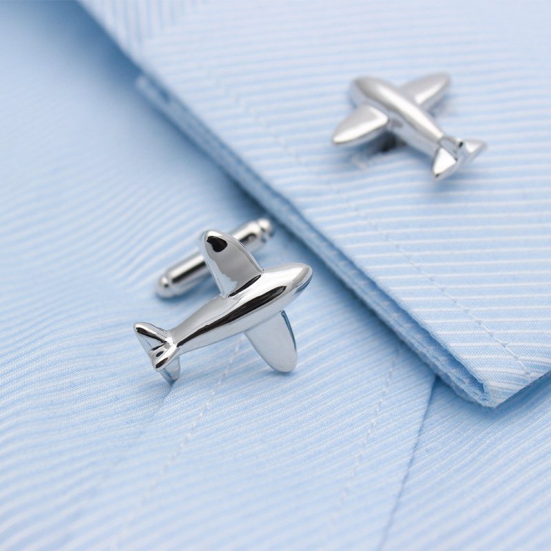 A pair of stylish airplane model cufflinks made from titanium alloy, presented in a hard-sided box, perfect for formal occasions.