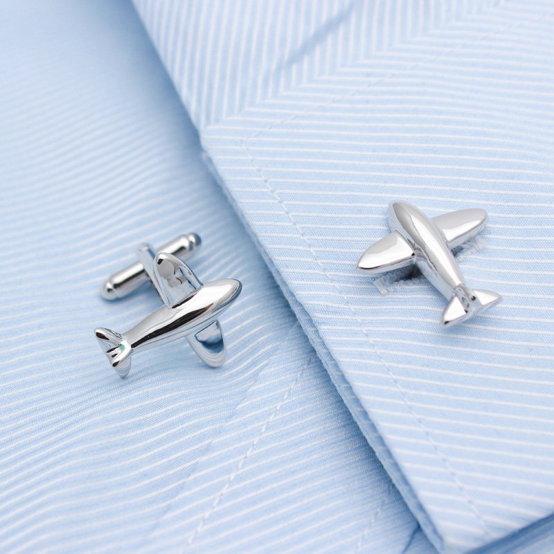 A pair of stylish airplane model cufflinks made from titanium alloy, presented in a hard-sided box, perfect for formal occasions.