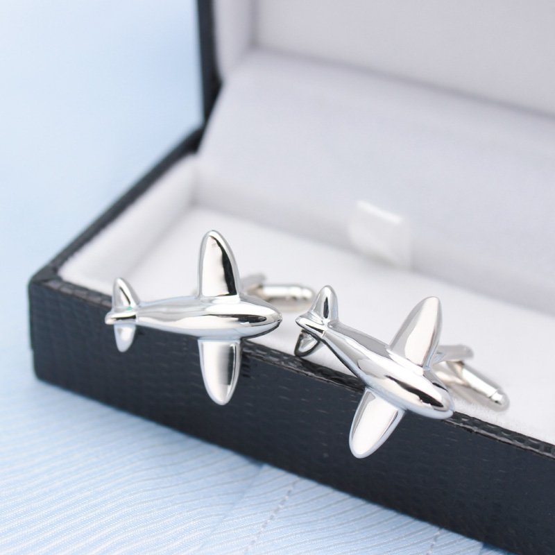 A pair of stylish airplane model cufflinks made from titanium alloy, presented in a hard-sided box, perfect for formal occasions.