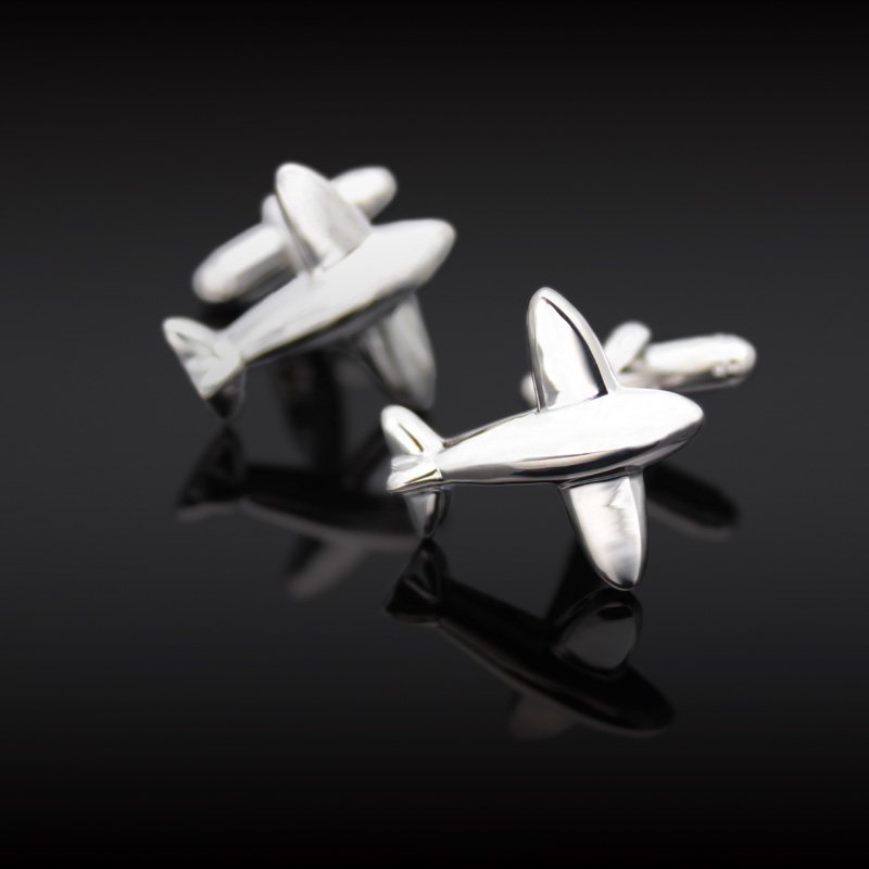 A pair of stylish airplane model cufflinks made from titanium alloy, presented in a hard-sided box, perfect for formal occasions.