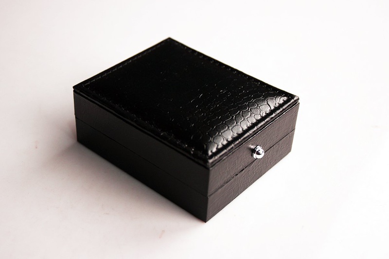 Stylish Bubble Level Cufflinks made of stainless steel with a polished rhodium finish, displayed in an elegant gift box.