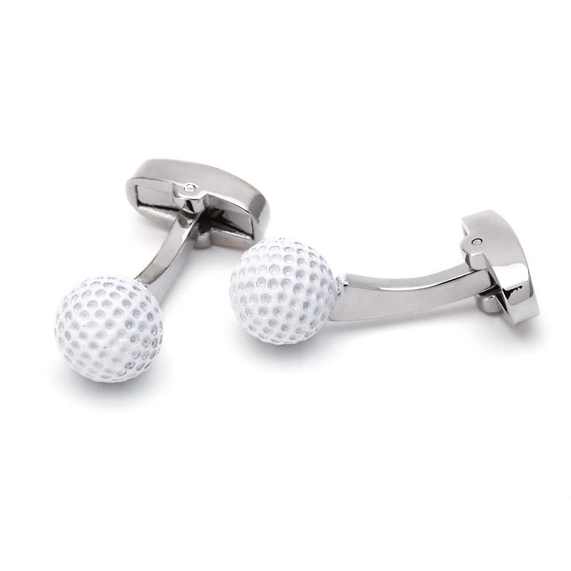 A pair of stainless steel golf ball cufflinks, hand-painted, displayed in a luxury presentation box, showcasing their unique design.