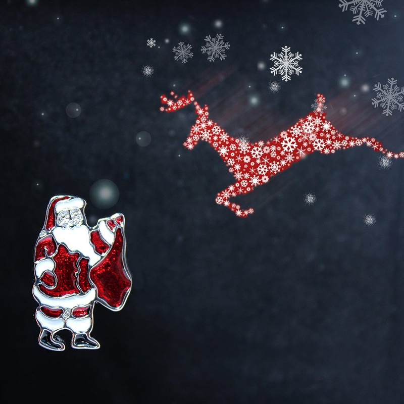 A pair of Santa Claus cufflinks made from stainless steel with a shiny rhodium plating, presented in a stylish gift box.