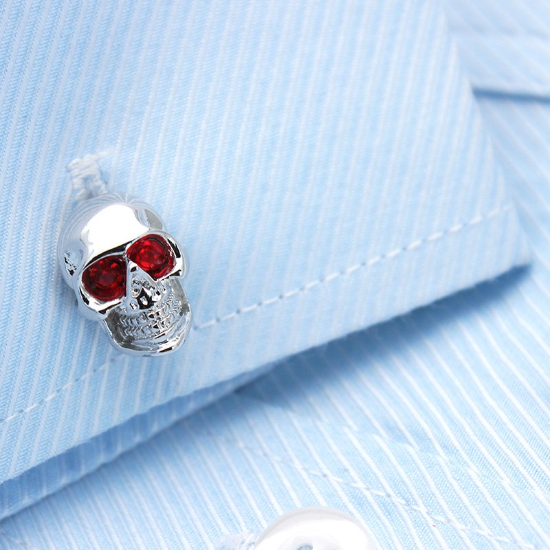 Stylish skull cufflinks made of stainless steel with rhodium plating, presented in a hard-sided gift box.