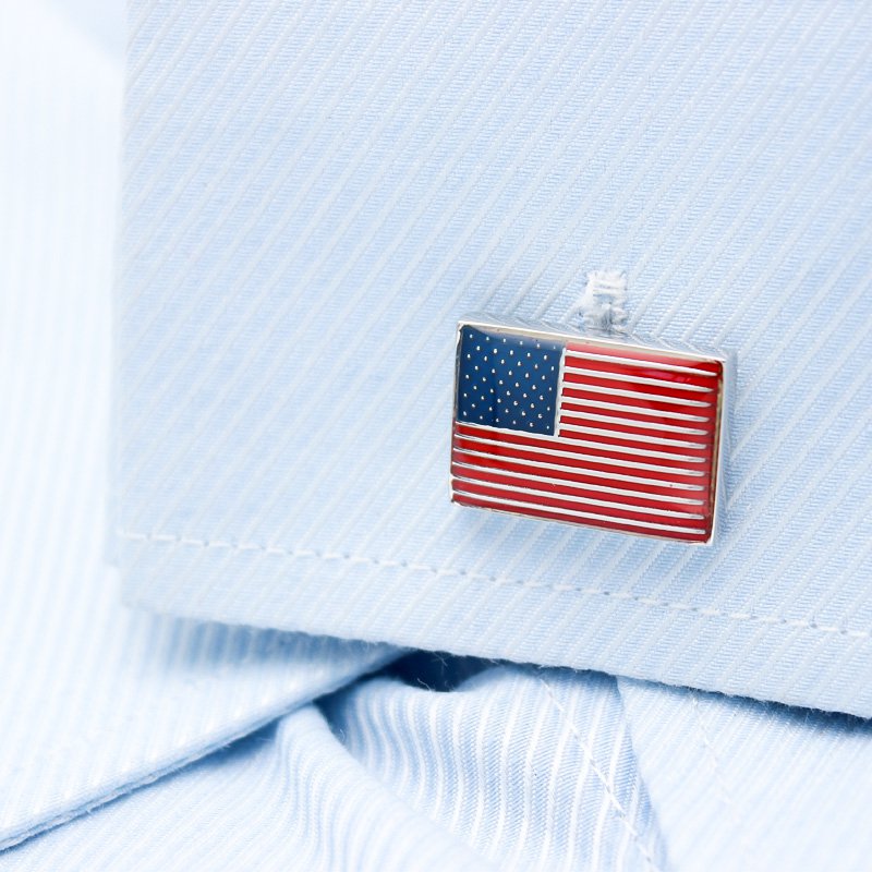 A pair of United States Flag Cufflinks made from titanium alloy, featuring a hand-painted finish, displayed in a hard-sided presentation box.