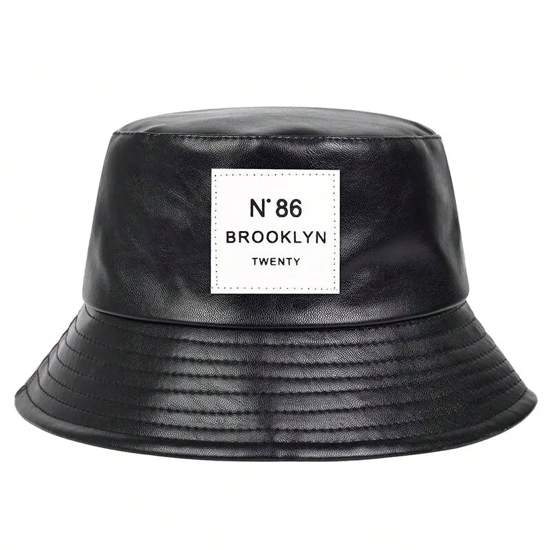 Bad Boy Bucket Beach Hat in black faux leather, stylish and unisex design suitable for casual outings.
