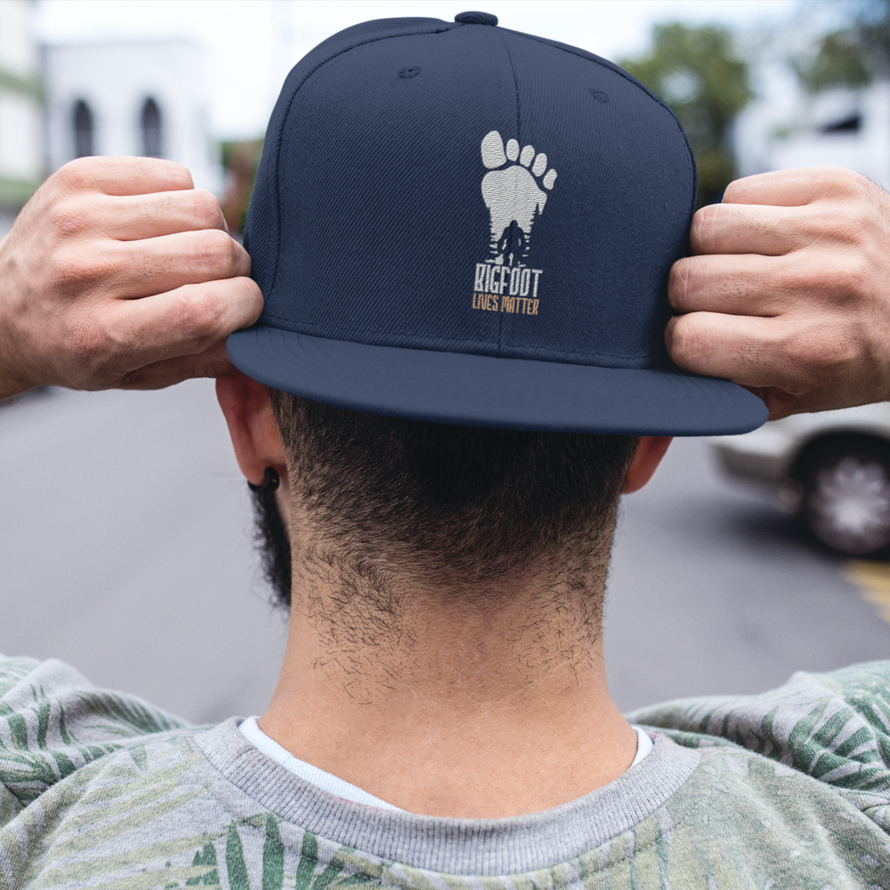 Bigfoot Lives Matter Embroidered Flat Bill Cap featuring a structured design and green under visor.