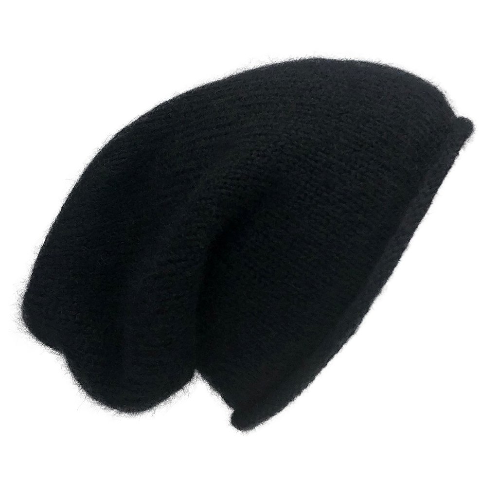A stylish black essential knit alpaca beanie, showcasing its slouchy design and luxurious texture, handmade in Peru.