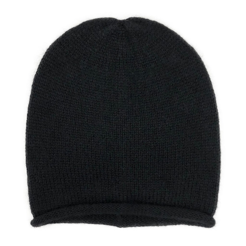 A stylish black essential knit alpaca beanie, showcasing its slouchy design and luxurious texture, handmade in Peru.