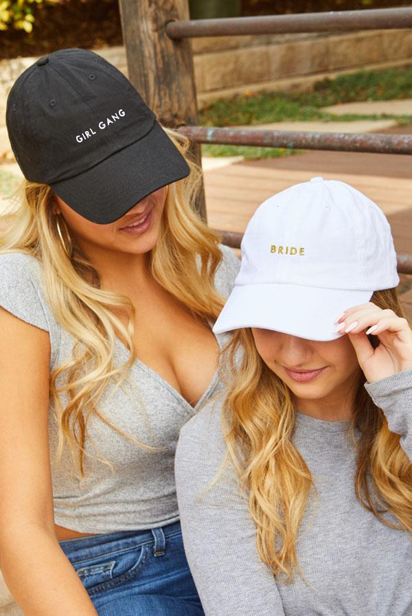 Bride and Girl Gang bachelorette party dad hats in white and black, featuring stylish text designs.