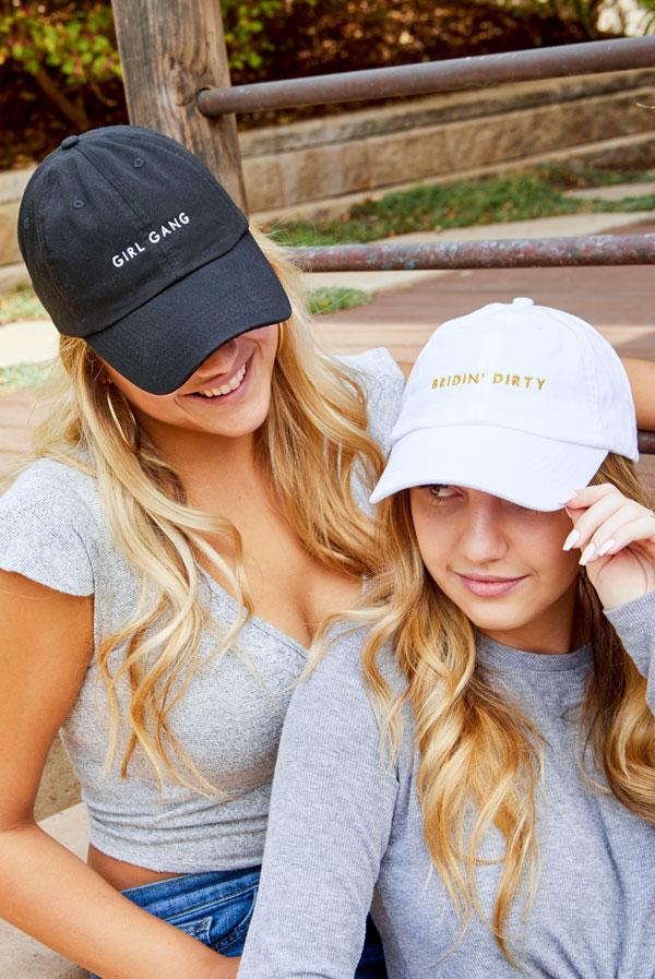 Bride and Girl Gang bachelorette party dad hats in white and black, featuring stylish text designs.
