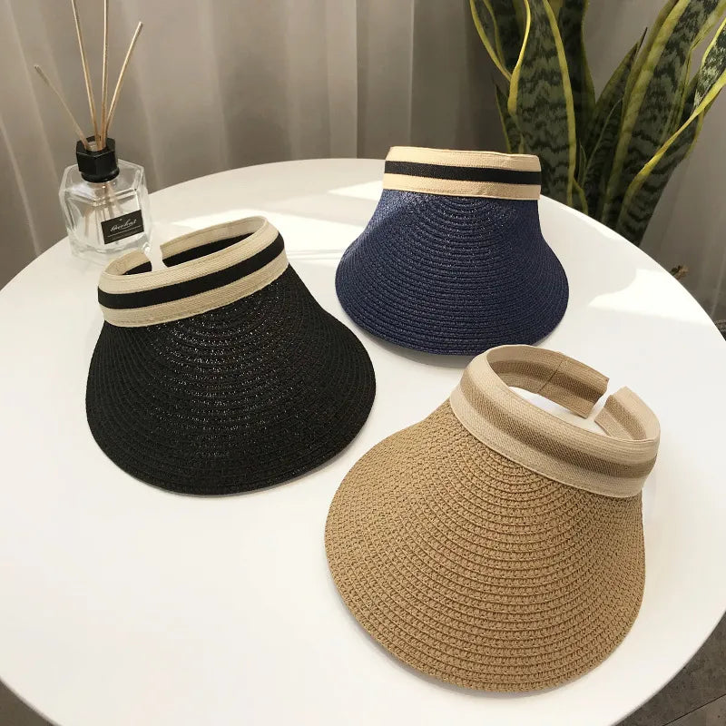 Cindy Visor hat made of straw, designed for women's sun protection, featuring a stylish and casual look for spring and summer.