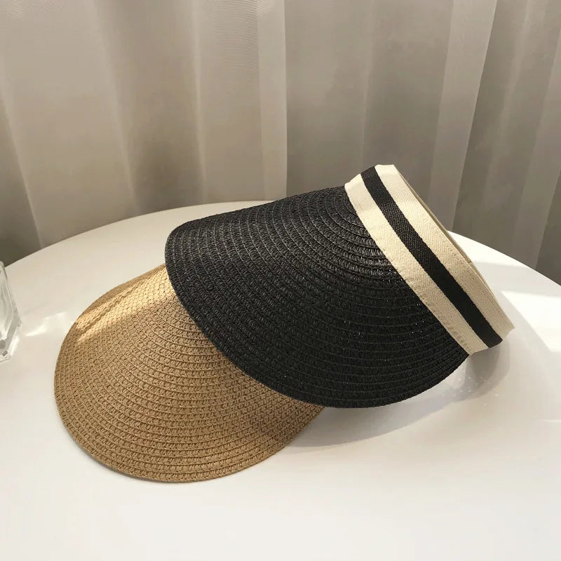 Cindy Visor hat made of straw, designed for women's sun protection, featuring a stylish and casual look for spring and summer.