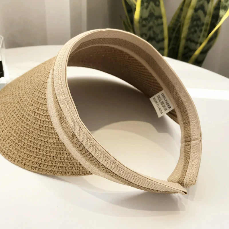 Cindy Visor hat made of straw, designed for women's sun protection, featuring a stylish and casual look for spring and summer.