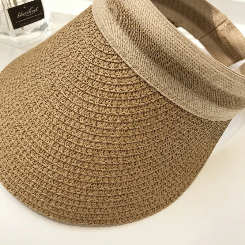 Cindy Visor hat made of straw, designed for women's sun protection, featuring a stylish and casual look for spring and summer.