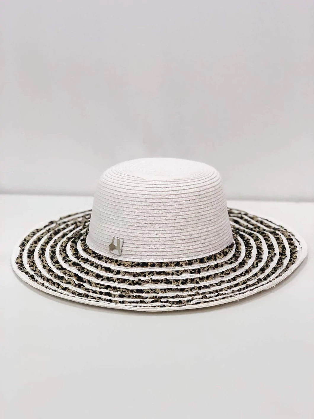 Fancy Feline Sun Floppy Hat with animal print ribbon and wide brim, perfect for sunny days.