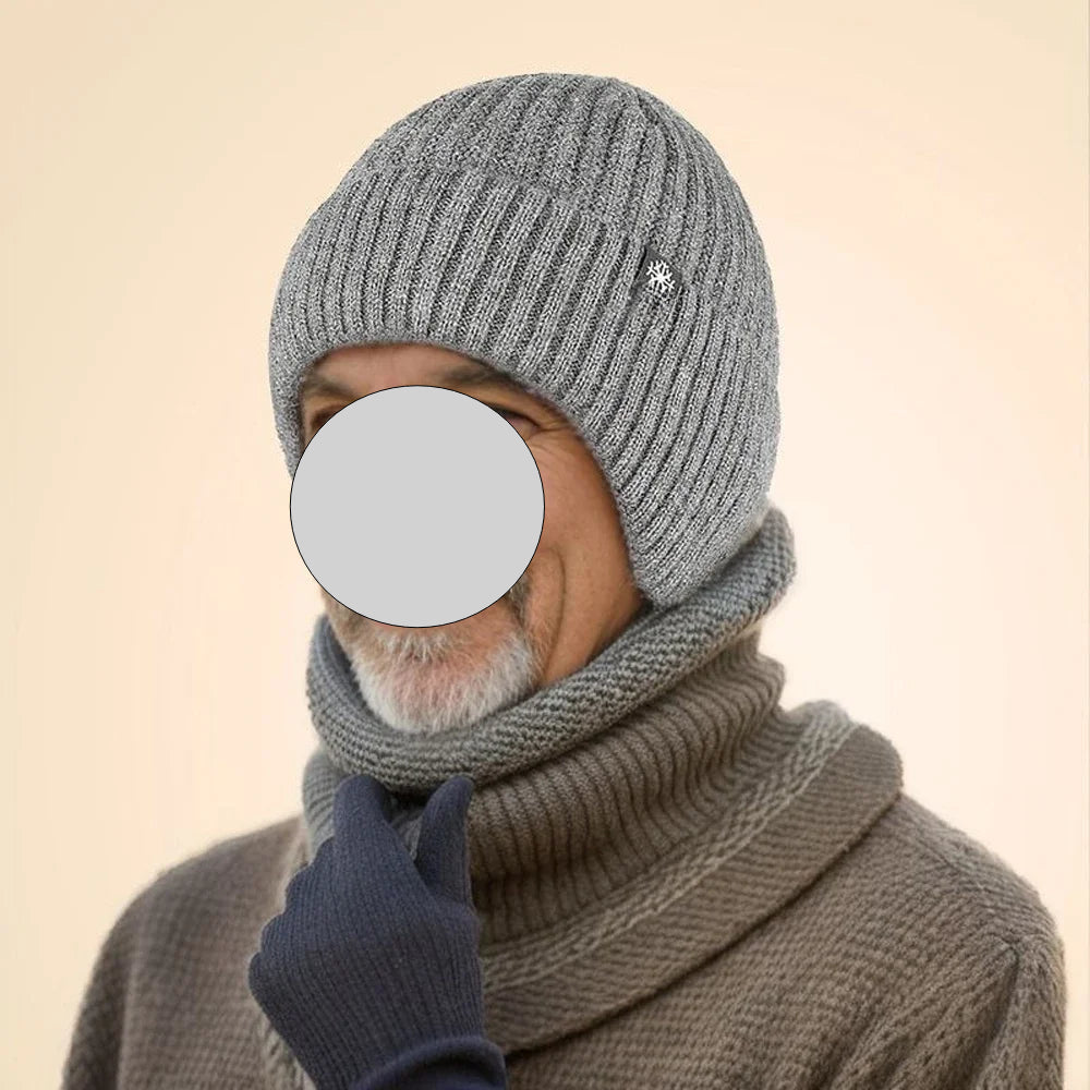 A stylish men's winter hat in black, navy blue, and light gray, featuring plush material and ear protection for warmth.