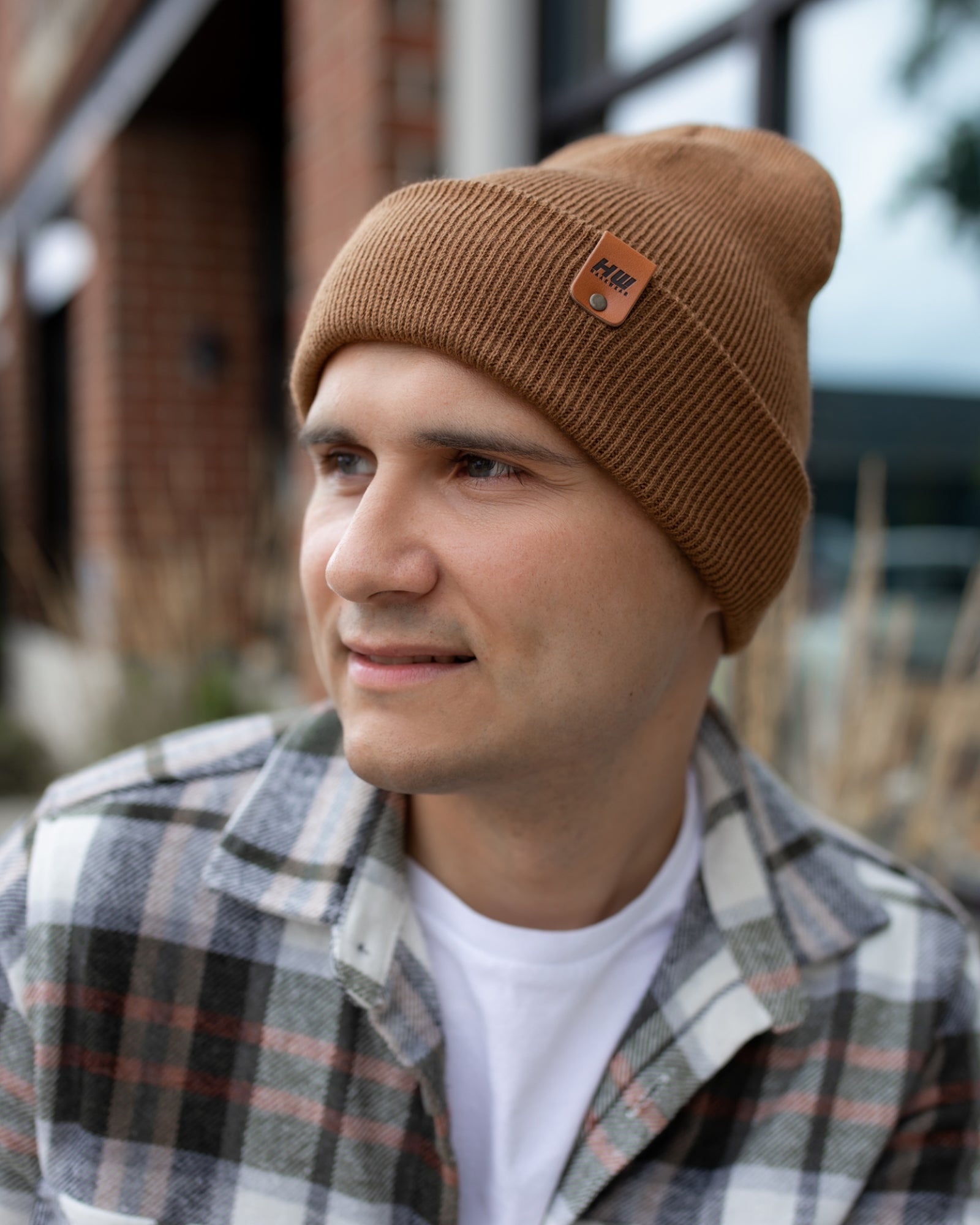 HAAKWEAR Knit Cuffed Beanie in Camel Brown, showcasing its stylish design and soft texture.