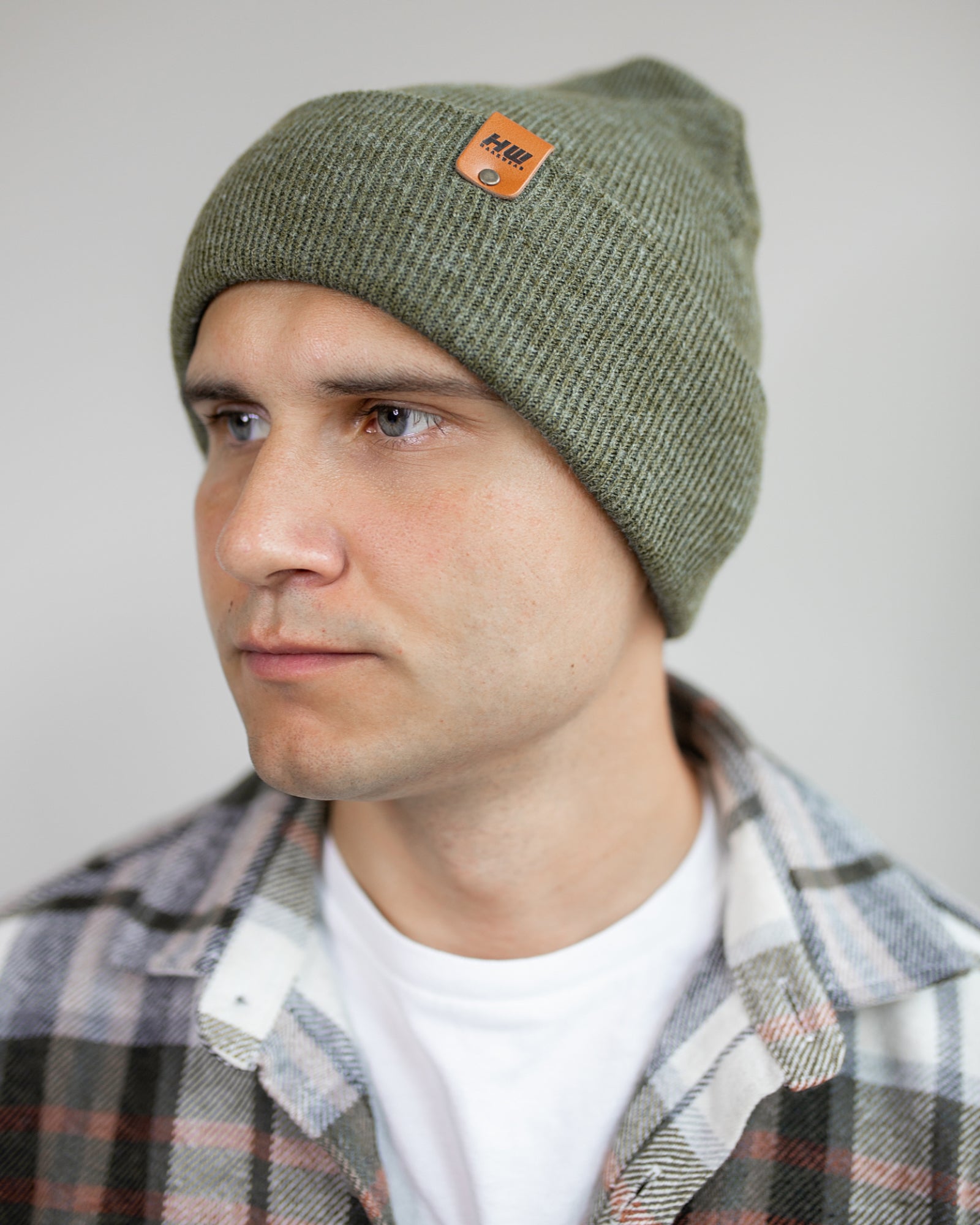 HAAKWEAR Knit Cuffed Beanie in Forest Green, showcasing its stylish design and quality craftsmanship.