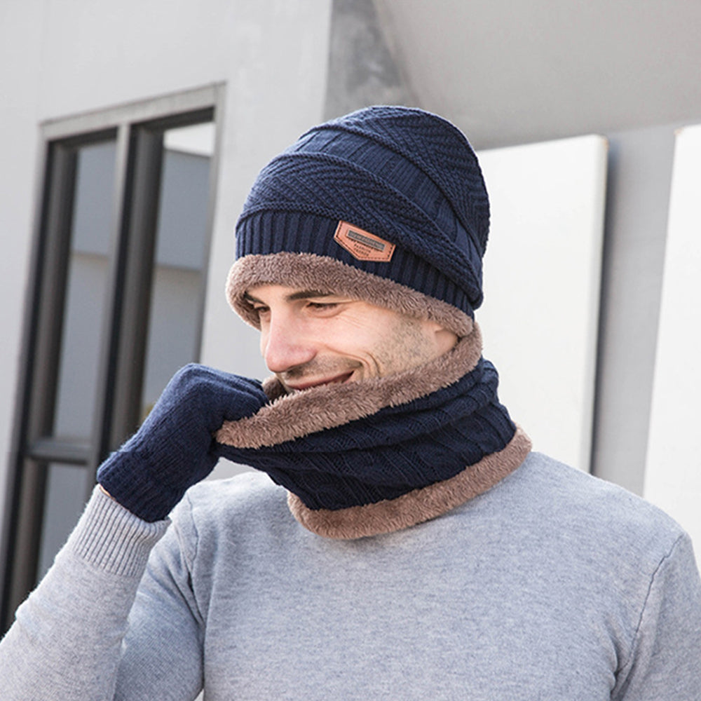 A cozy three-piece winter set including a knitted wool hat, scarf, and touchscreen gloves in vibrant colors.