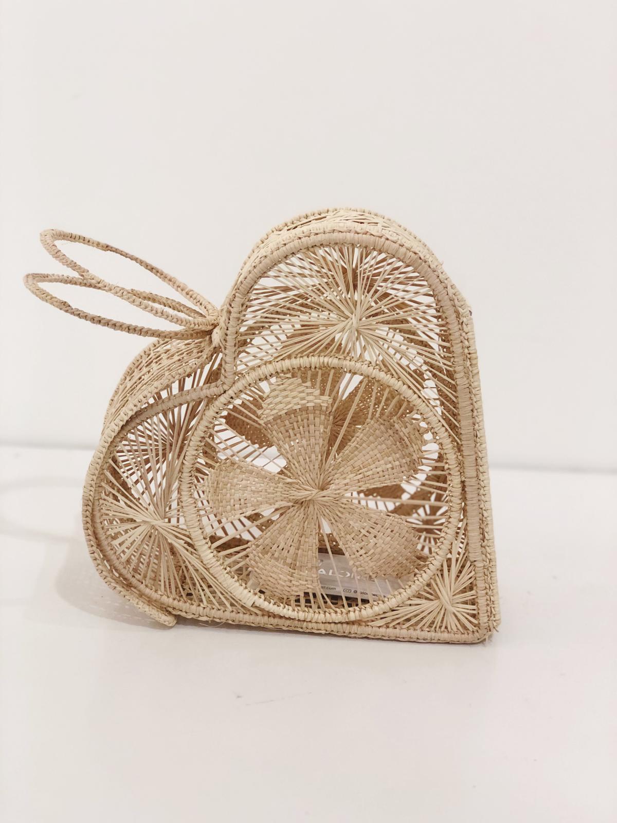 Natural 'All My Love' Heart Artisan Clutch showcasing its unique heart shape and artisan craftsmanship.