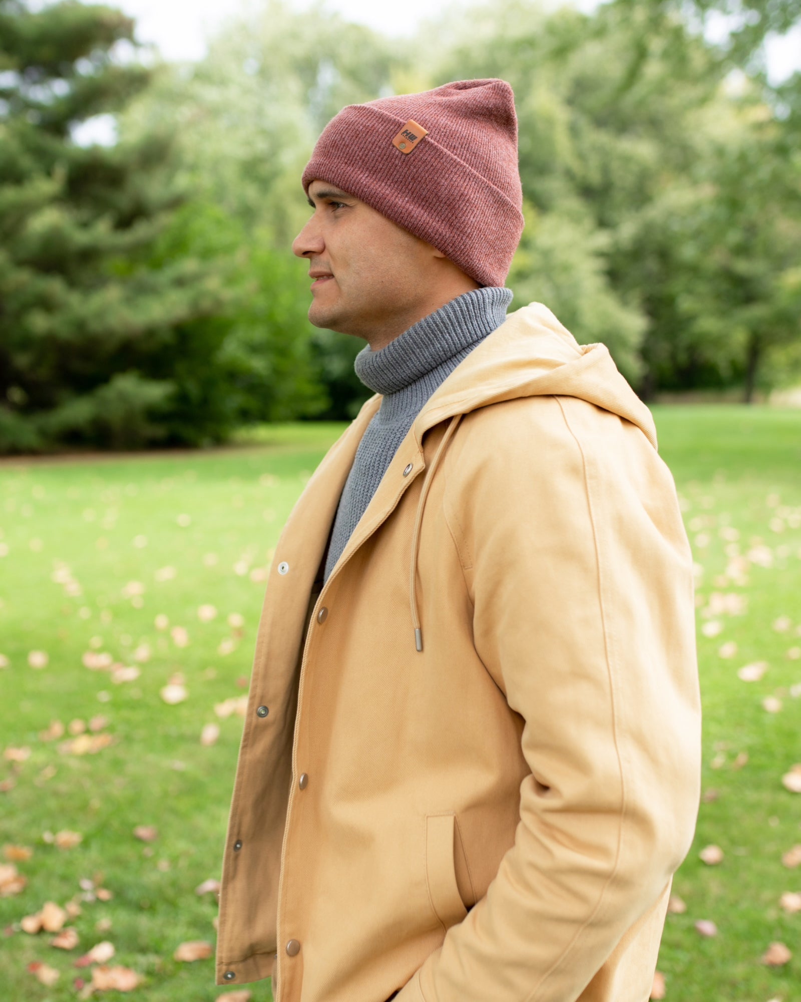NEW HAAKWEAR Theta-Stitch Cuffed Beanie in Rusty Burgundy, showcasing its unique design and comfortable fit.