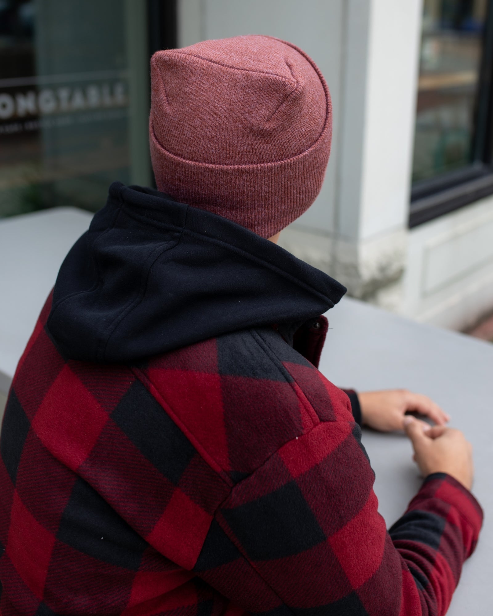 NEW HAAKWEAR Theta-Stitch Cuffed Beanie in Rusty Burgundy, showcasing its unique design and comfortable fit.