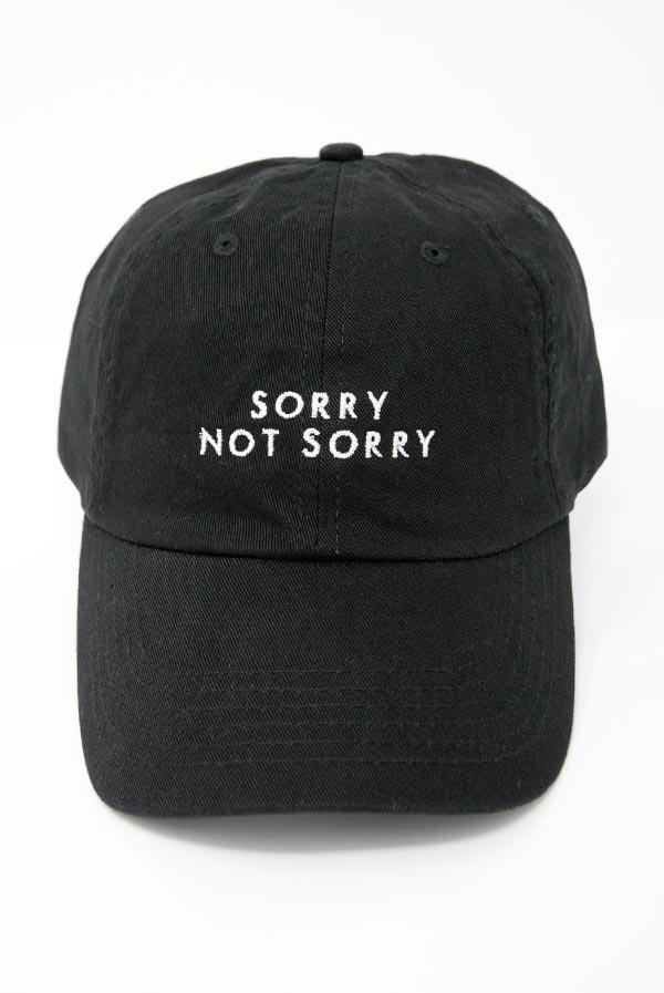 Two stylish dad hats for bachelorette parties, one white with 'Sorry Not Single' and one black with 'Sorry Not Sorry', showcasing their trendy designs.