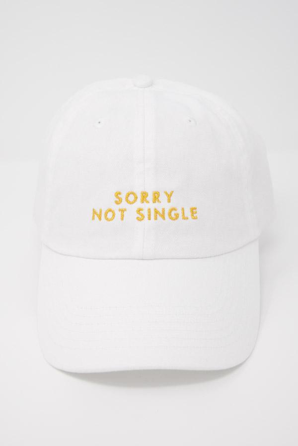 Two stylish dad hats for bachelorette parties, one white with 'Sorry Not Single' and one black with 'Sorry Not Sorry', showcasing their trendy designs.