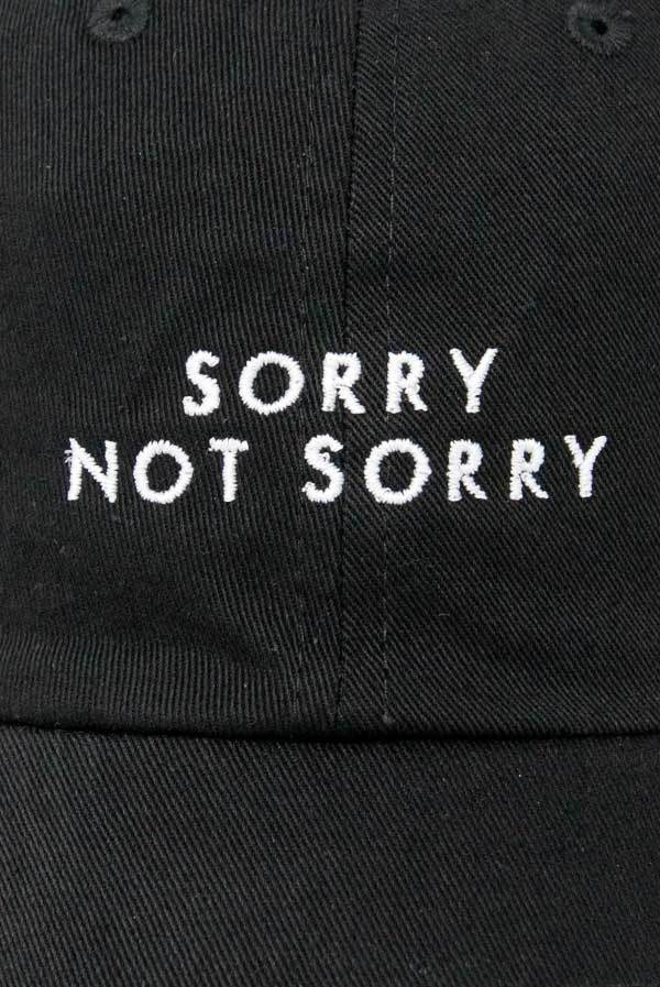 Two stylish dad hats for bachelorette parties, one white with 'Sorry Not Single' and one black with 'Sorry Not Sorry', showcasing their trendy designs.