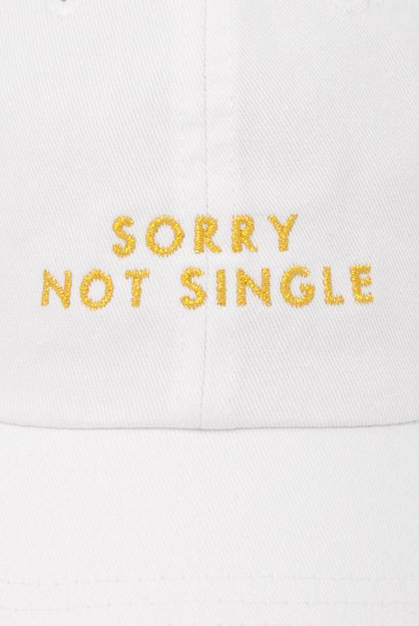 Two stylish dad hats for bachelorette parties, one white with 'Sorry Not Single' and one black with 'Sorry Not Sorry', showcasing their trendy designs.
