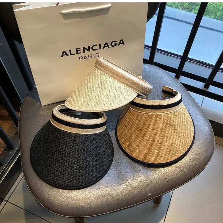 A stylish Sexikinis Straw Sun Visor Hat featuring a trendy plaid pattern and snapback closure, perfect for summer outings.