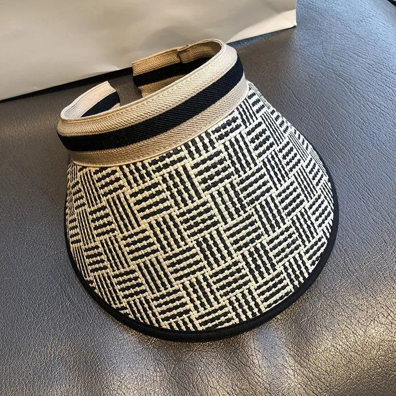 A stylish Sexikinis Straw Sun Visor Hat featuring a trendy plaid pattern and snapback closure, perfect for summer outings.