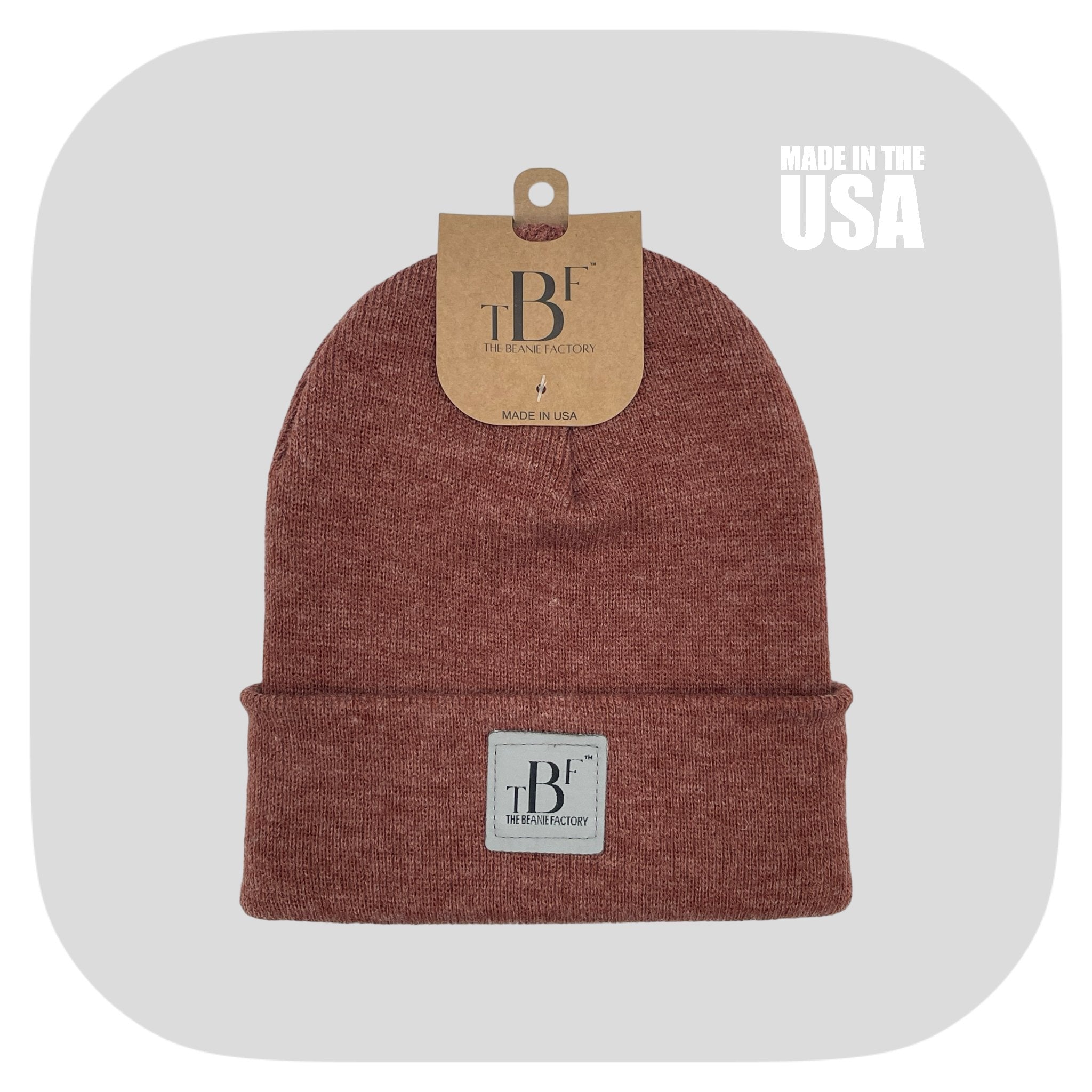 Cuffed beige winter beanie hat from The Beanie Factory, showcasing its soft texture and unisex design.