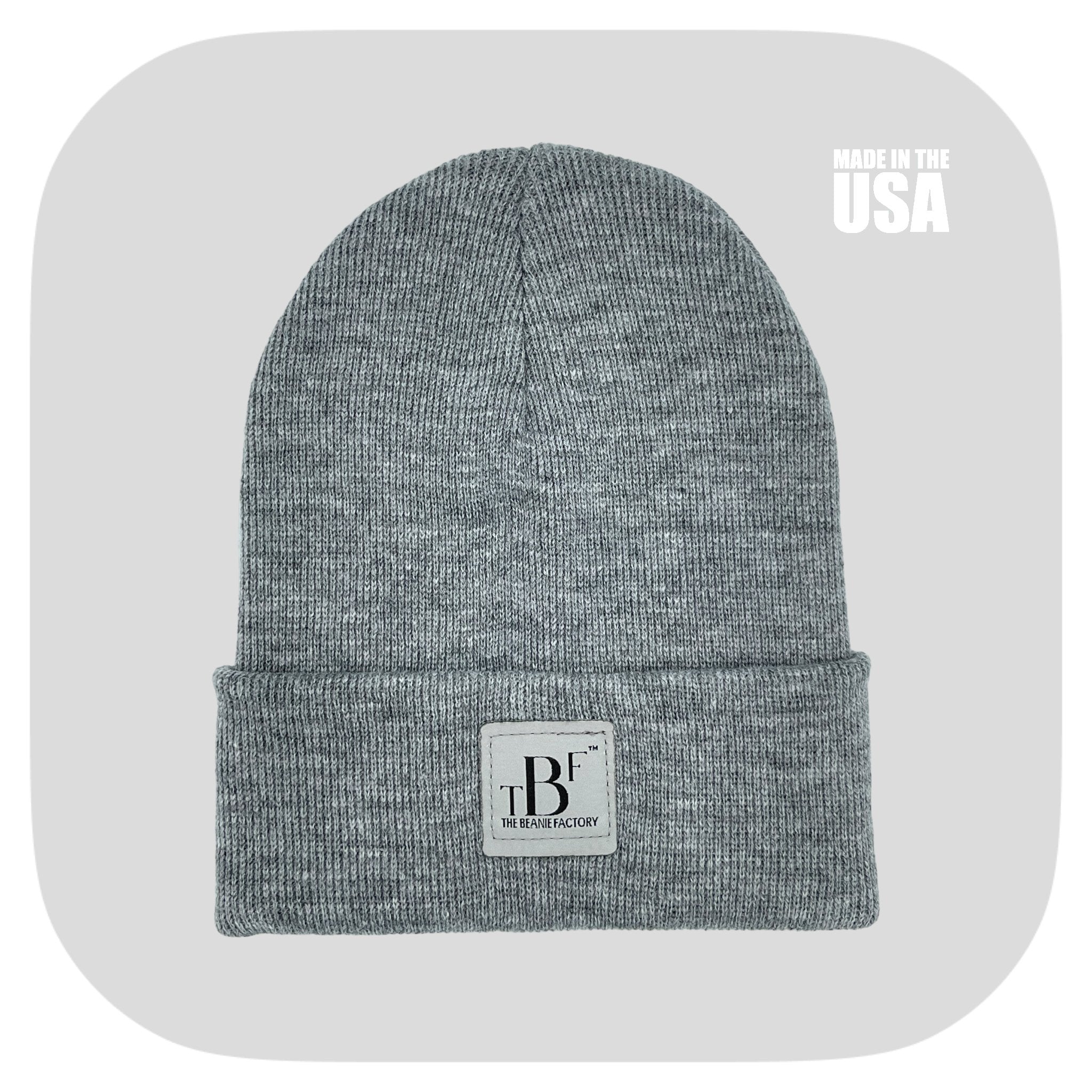 Cuffed gray winter beanie from The Beanie Factory, showcasing its soft texture and stylish design, perfect for cold weather.