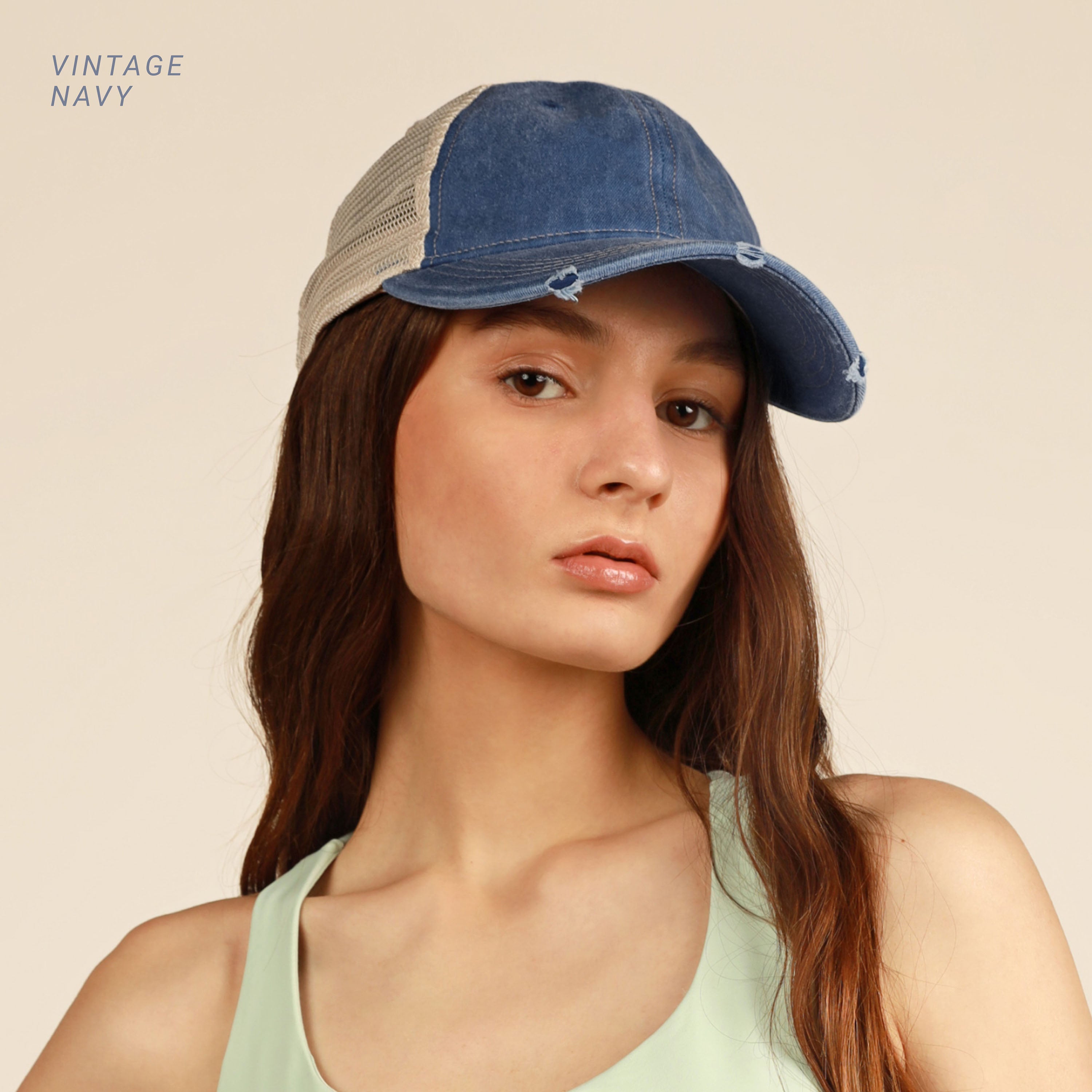 Vintage Mesh Trucker Cap with adjustable fit and distressed bill, perfect for outdoor activities.