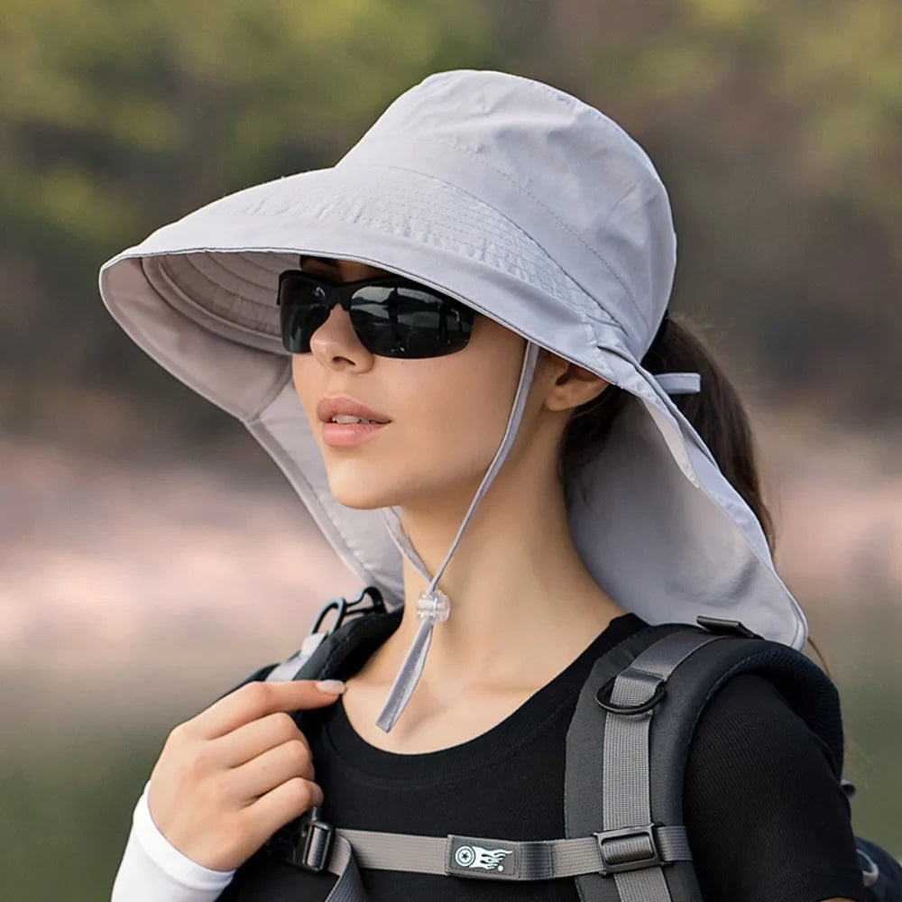 Wide large brim bucket hat in cotton, providing sun protection for outdoor activities.