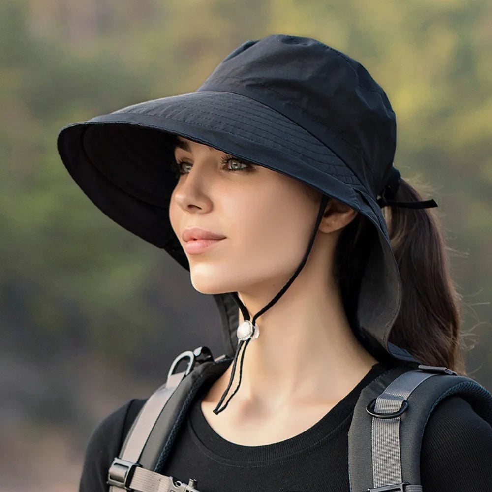 Wide large brim bucket hat in cotton, providing sun protection for outdoor activities.