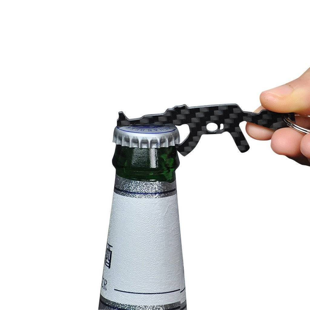 Real Carbon Fiber AK-47 shaped keychain and bottle opener, showcasing its sleek design and carbon fiber texture.