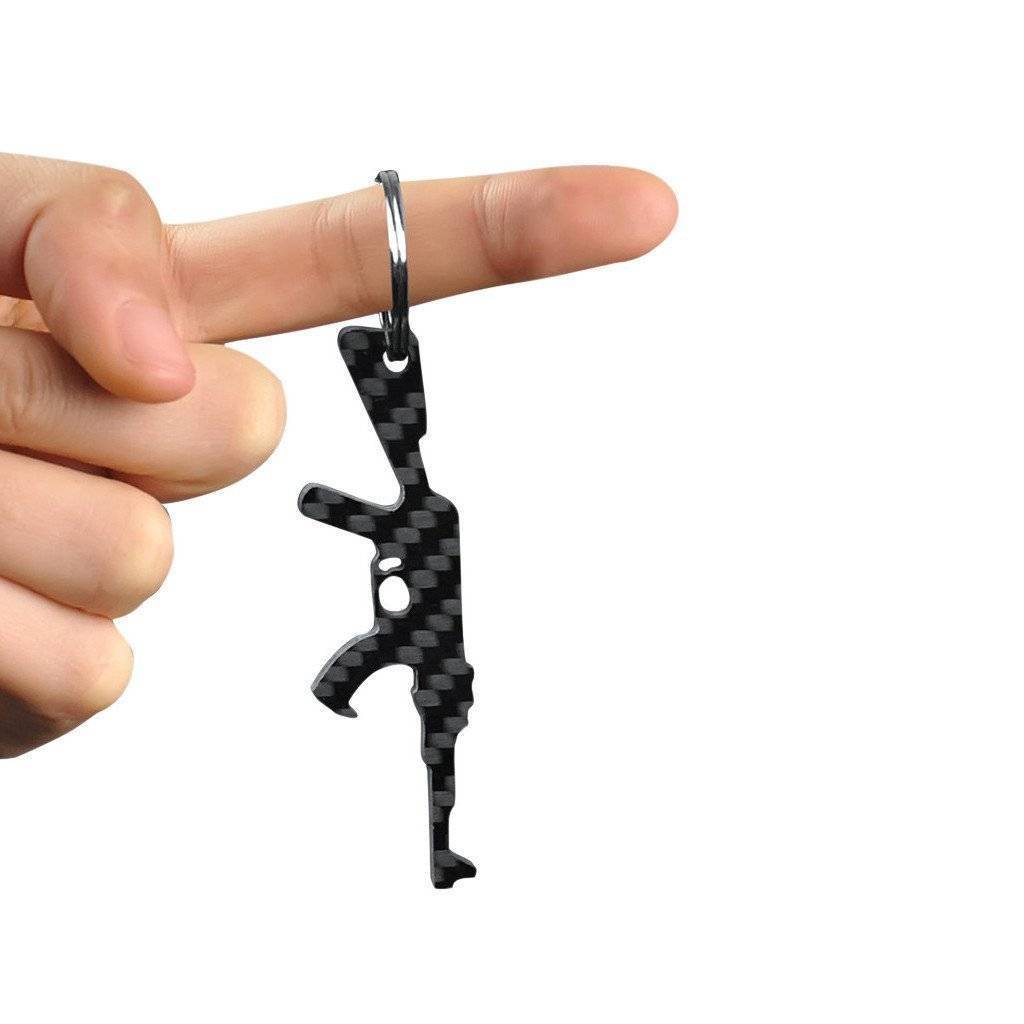 Real Carbon Fiber AK-47 shaped keychain and bottle opener, showcasing its sleek design and carbon fiber texture.