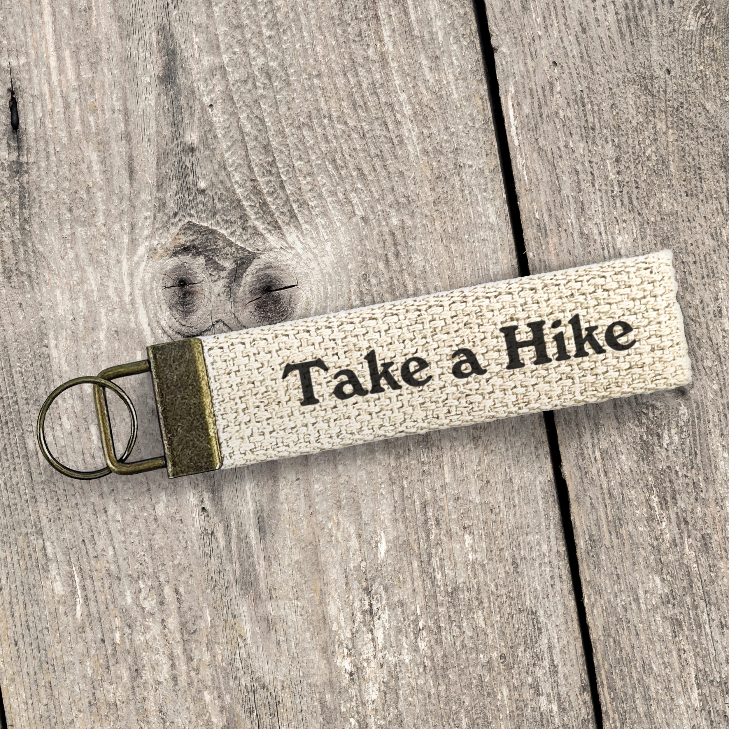 Take a Hike Canvas Key Fob featuring heavy-duty cotton webbing and durable bronze hardware, designed for key organization.