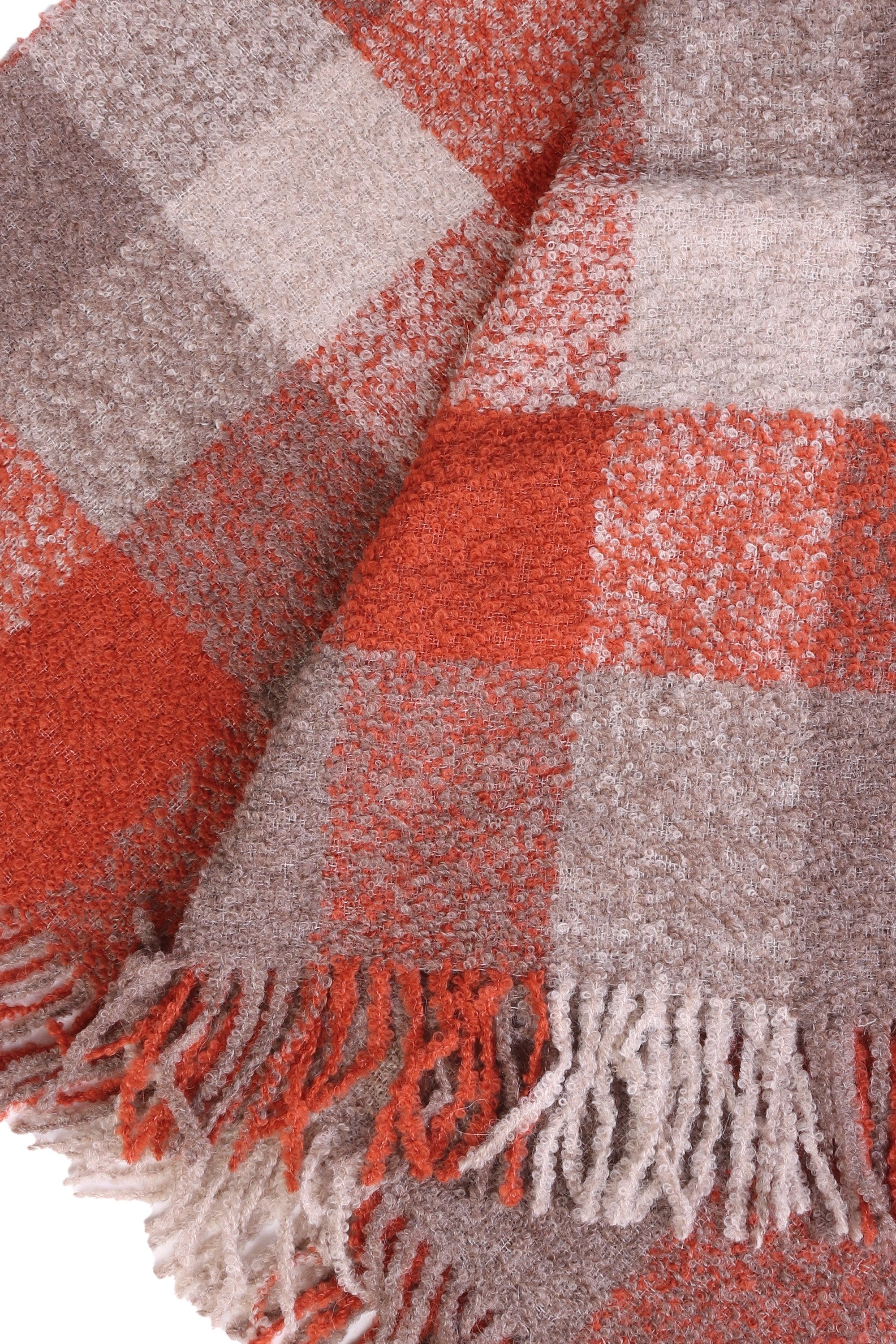 Luxurious red and grey checkered plaid made from 100% alpaca wool, showcasing its soft texture and elegant design.