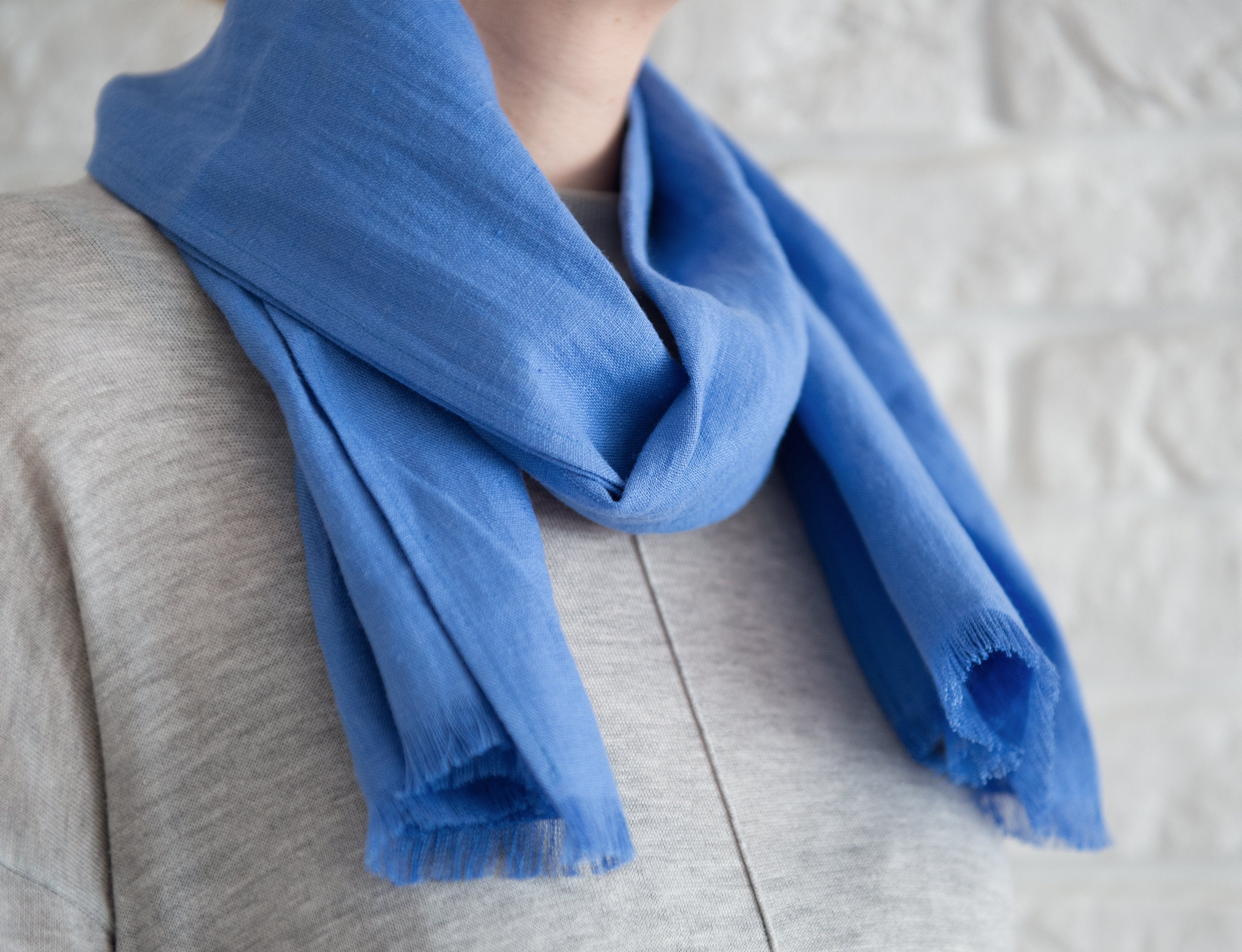 Cornflower Blue linen scarf made from 100% stonewashed linen, showcasing its elegant design and soft texture.