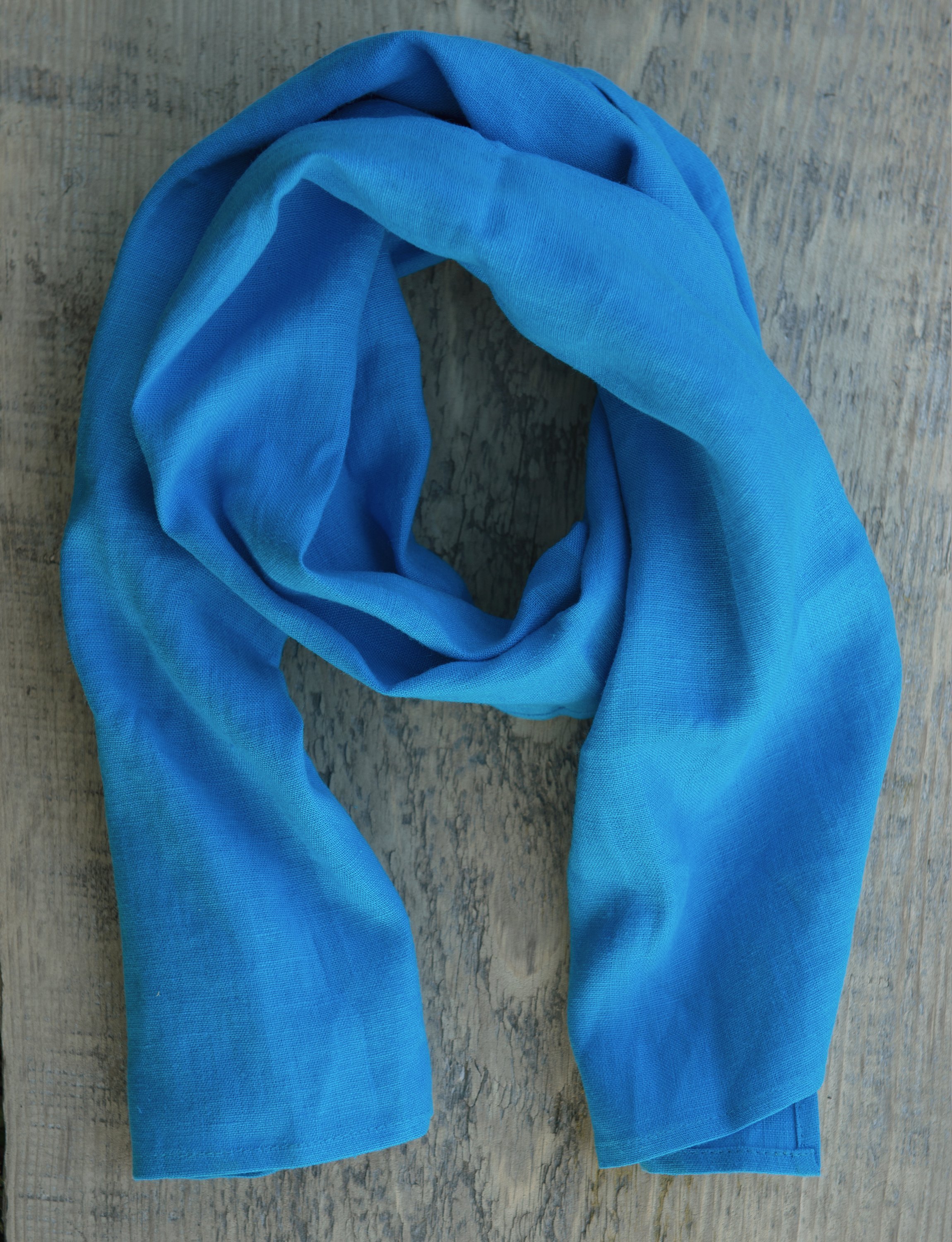 Cornflower Blue linen scarf made from 100% stonewashed linen, showcasing its elegant design and soft texture.