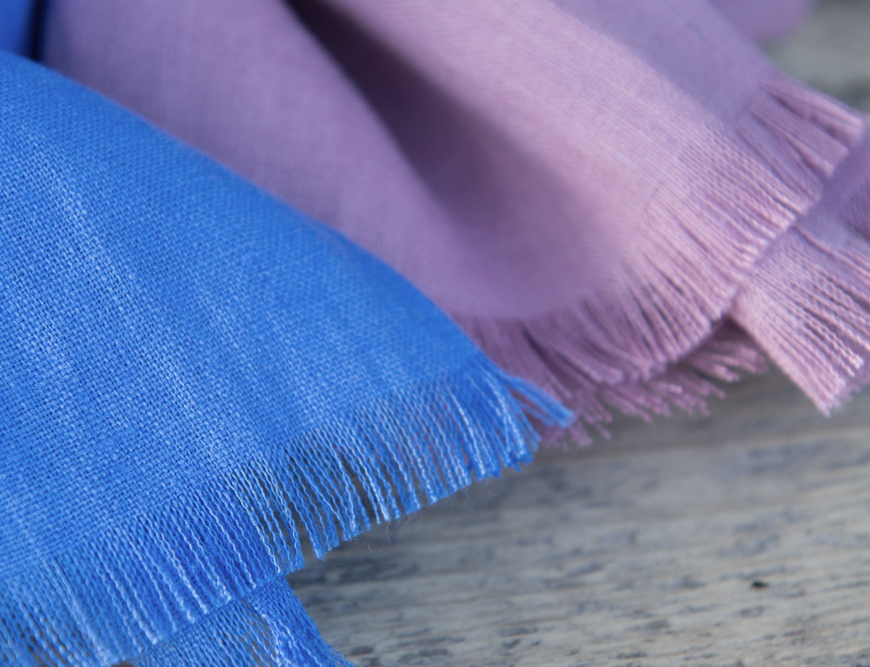 Cornflower Blue linen scarf made from 100% stonewashed linen, showcasing its elegant design and soft texture.