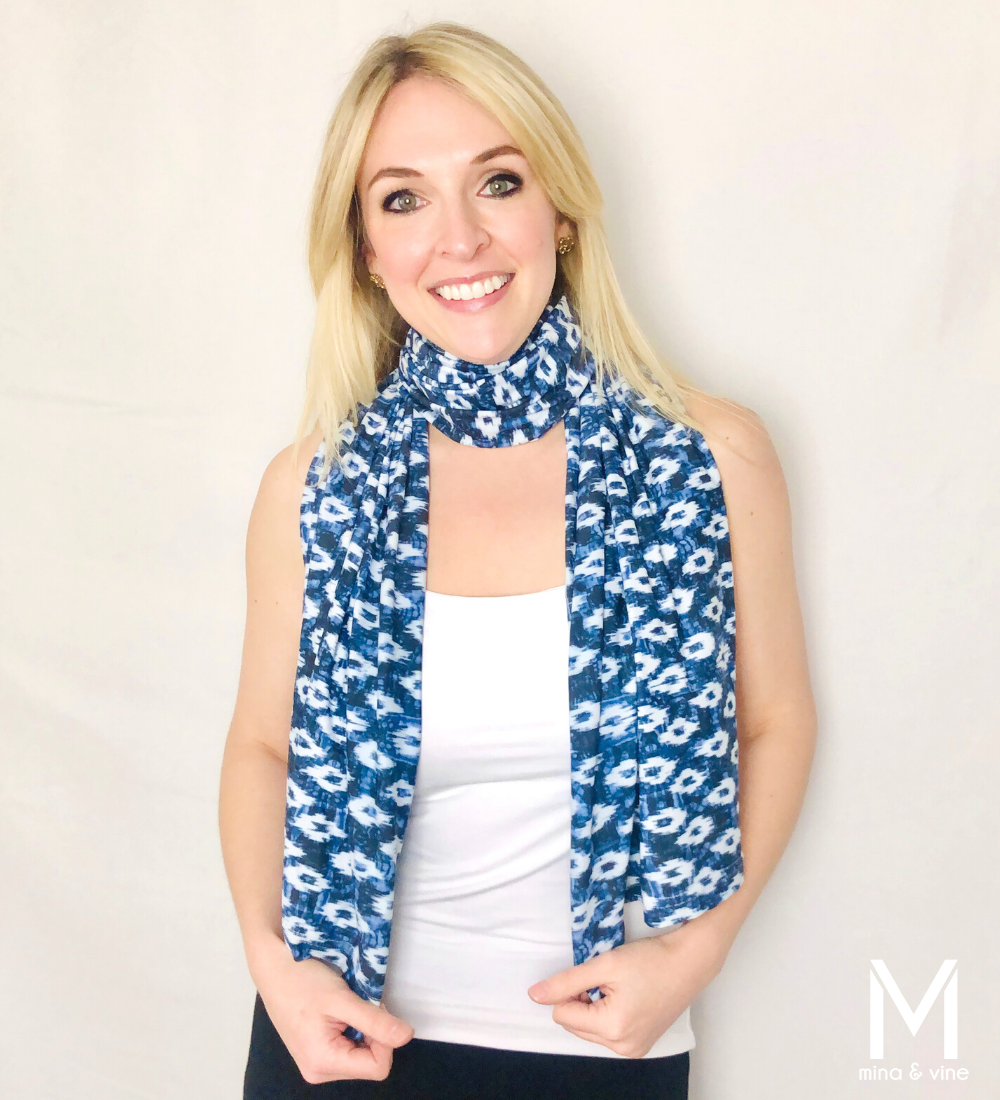 A stylish Eye-catching Ikat Multi-Way Smart Scarf featuring a vibrant Ikat print, designed for nursing and versatile use.