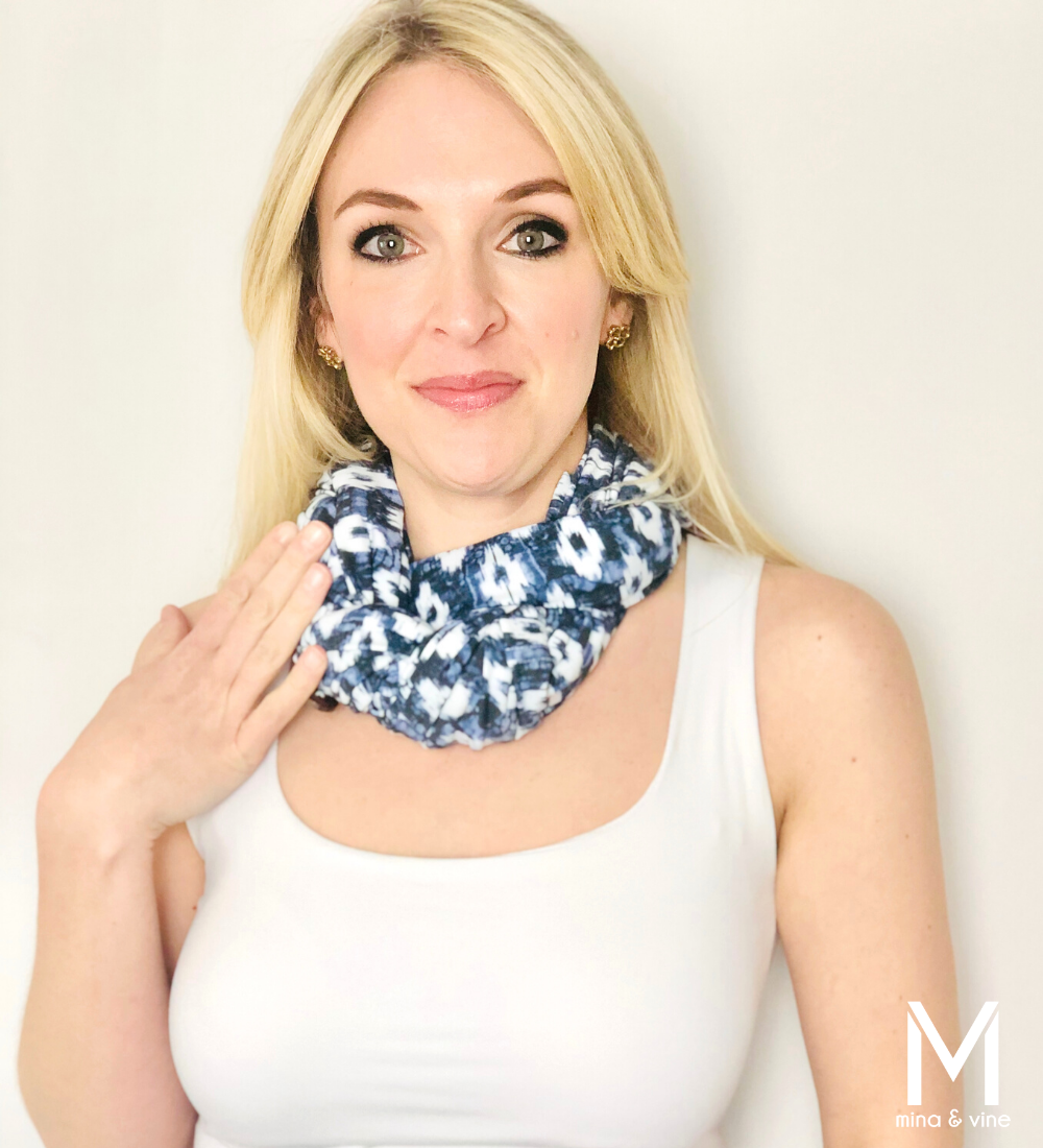 A stylish Eye-catching Ikat Multi-Way Smart Scarf featuring a vibrant Ikat print, designed for nursing and versatile use.