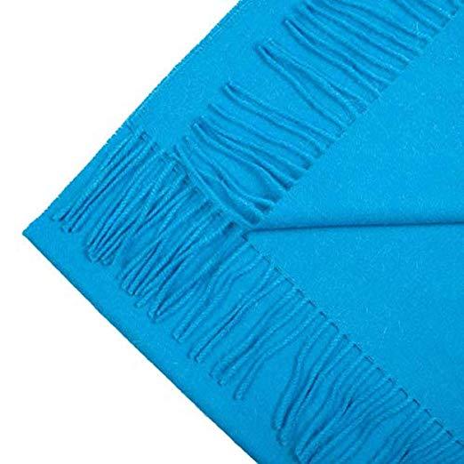 Luxurious blue scarf made from 100% baby alpaca wool, showcasing its soft texture and elegant design.