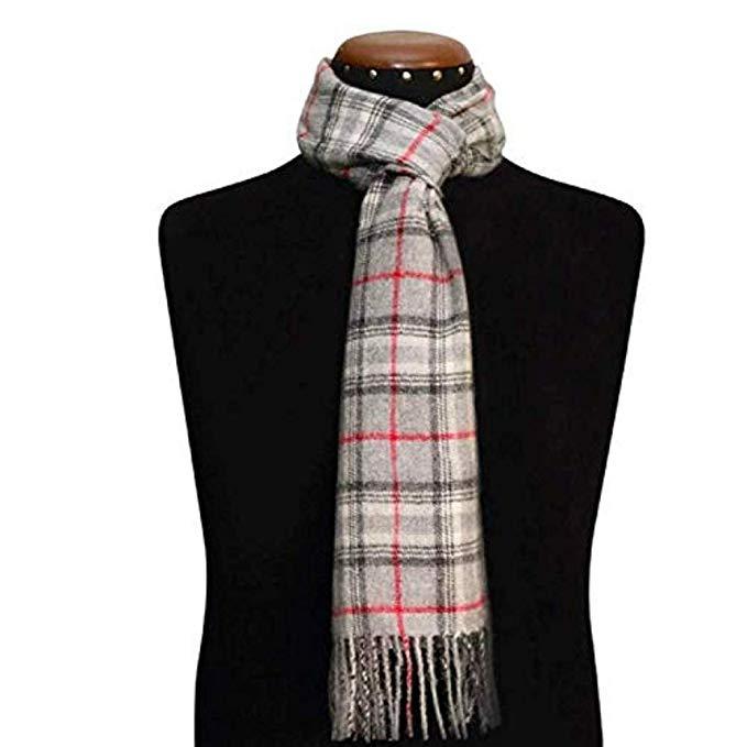 A luxurious grey scarf made from 100% baby alpaca wool, showcasing its soft texture and elegant design, perfect for winter wear.