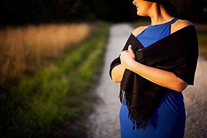 Luxurious black scarf made from 100% super baby alpaca wool, showcasing its soft texture and elegant design.